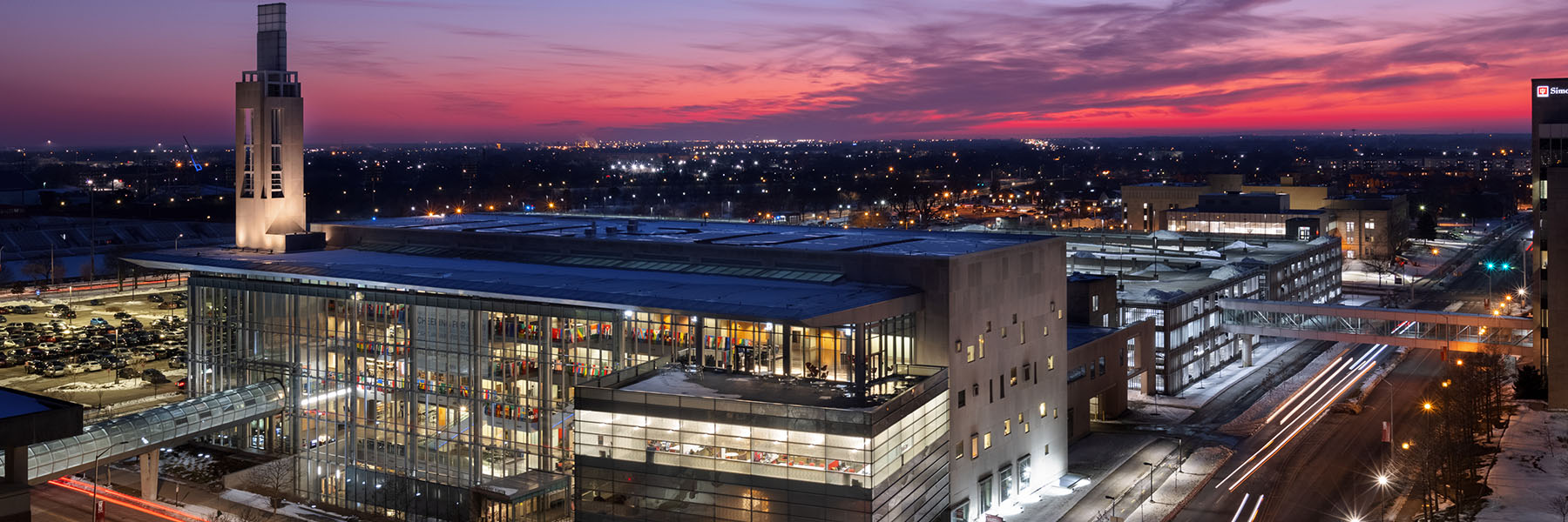 Exterior view of IU Indianapolis campus center and surrounding areas at night