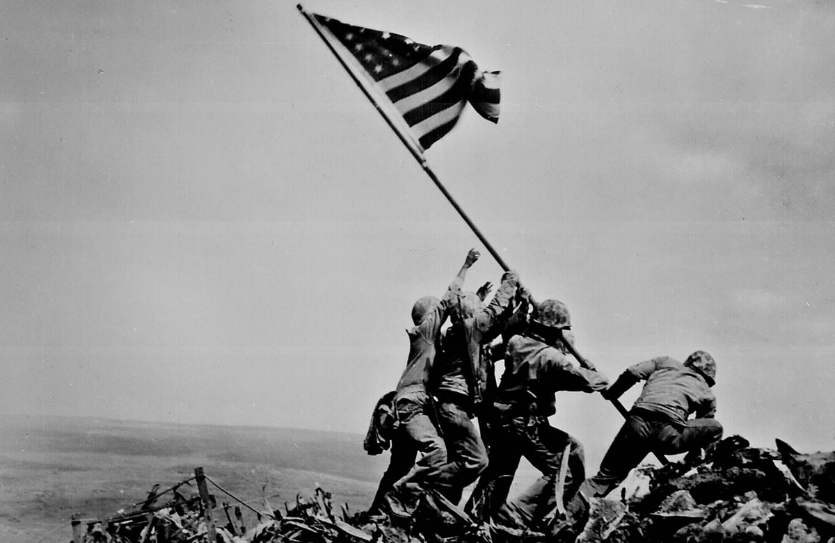 World War II soldiers raising flag