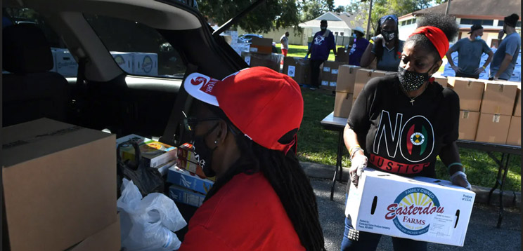 volunteers loading supplies for donation