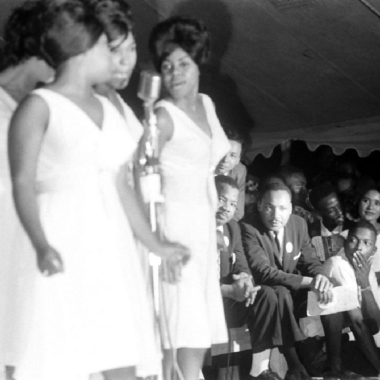 Martin Luther King Jr. (seated, at right) watched the Shirelles perform during the Salute to Freedom benefit concert in Birmingham, Ala., August 5, 1963. 
